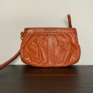 Coach orange leather wristlet